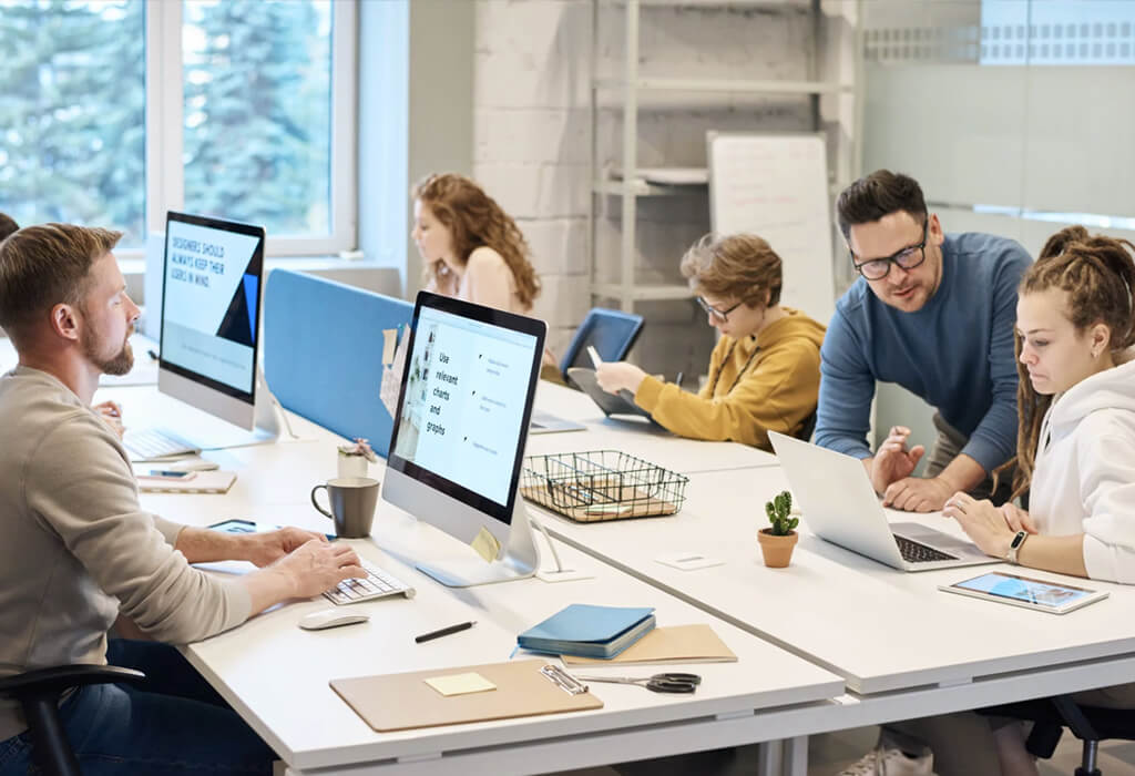 user collaborting on computers in an office setting